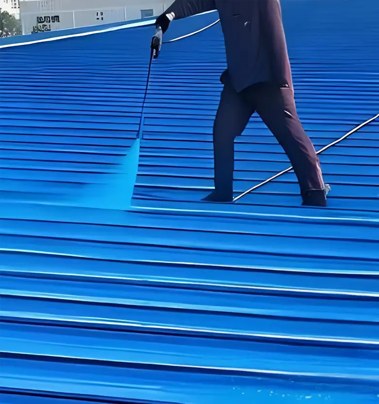Worker walking on blue waterproofing membrane during roof installation